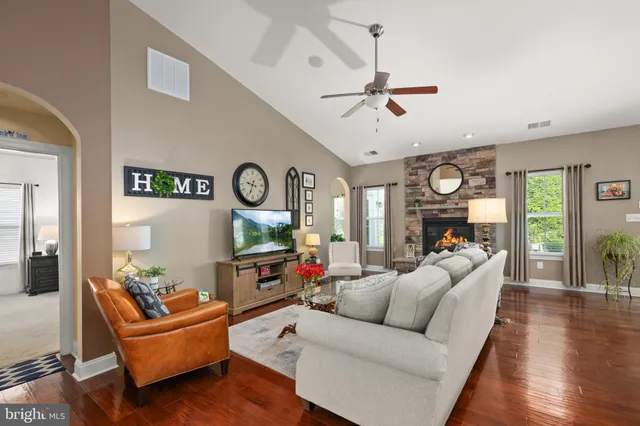 a living room with furniture and a rug