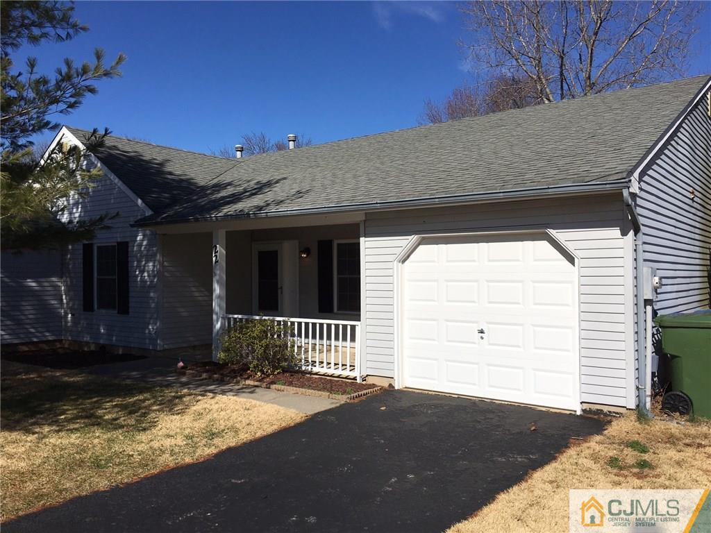 a view of a house with a small yard and a large window