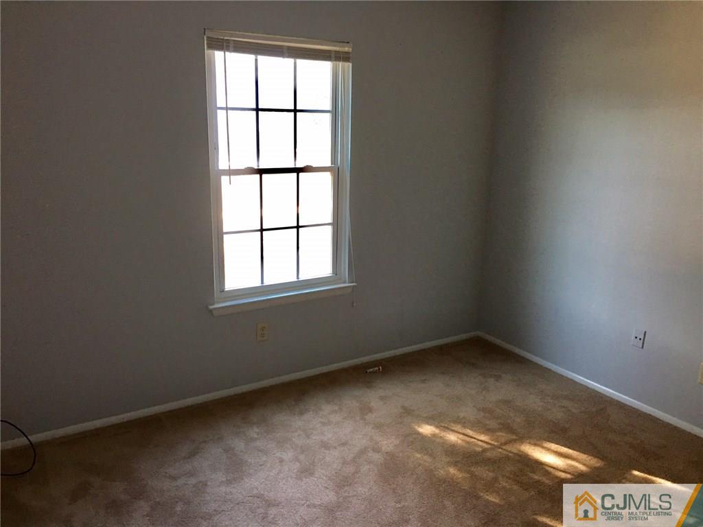 22 Woodbury Road Edison, NJ 08820 - Photo 16 of 25 an empty room with a window