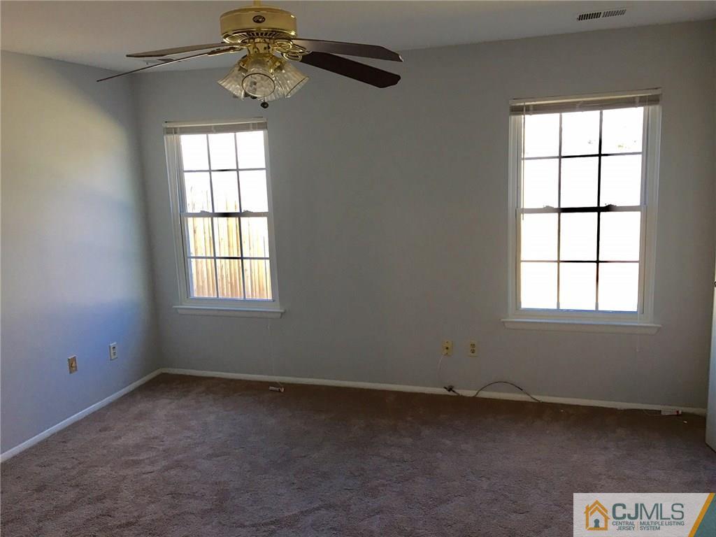 22 Woodbury Road Edison, NJ 08820 - Photo 20 of 25 an empty room with a window