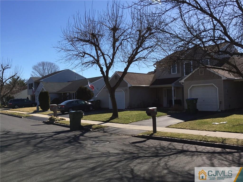 22 Woodbury Road Edison, NJ 08820 - Photo 23 of 25 a front view of a house with a yard