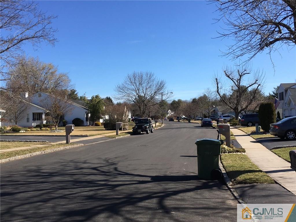 22 Woodbury Road Edison, NJ 08820 - Photo 24 of 25 a view of a lake with houses