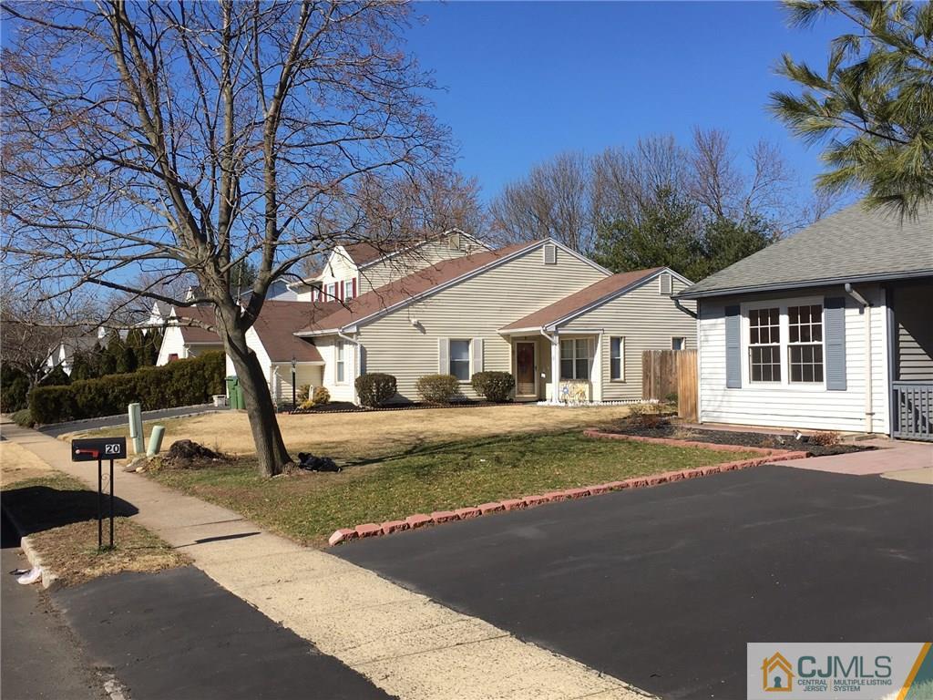 22 Woodbury Road Edison, NJ 08820 - Photo 25 of 25 a view of a white house with a yard