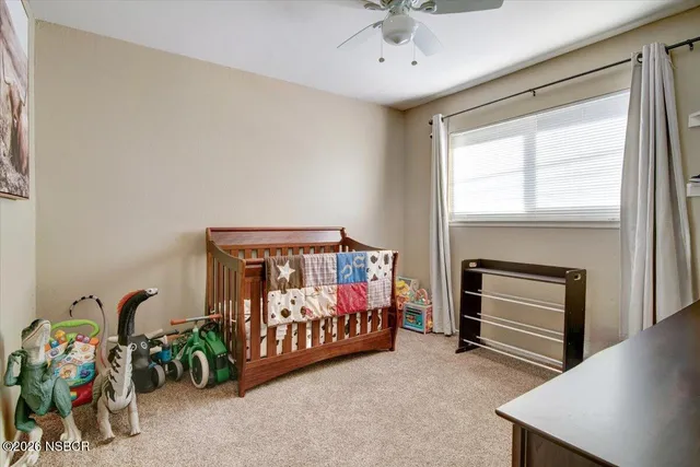 a bedroom with furniture and a window