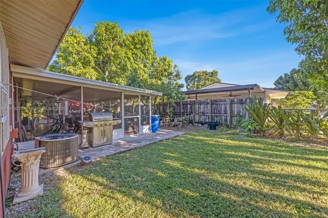 a view of a house with a backyard porch and sitting area