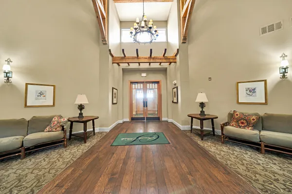 a living room with furniture and a rug