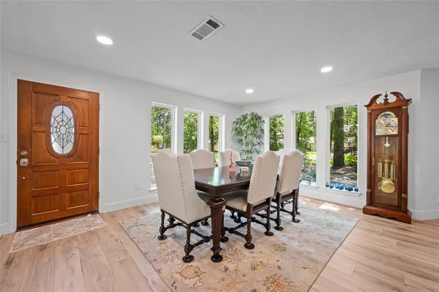 a view of a dining room with furniture window and wooden floor