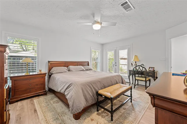 a bedroom with a bed and a table