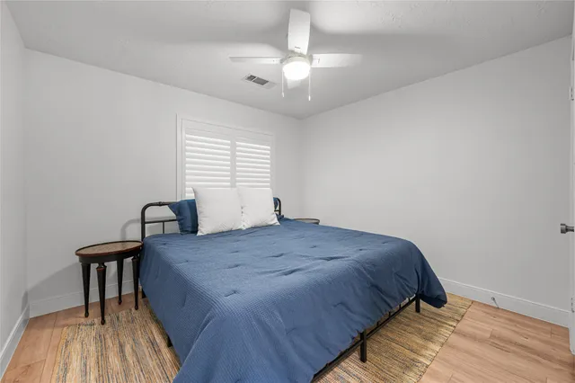 a bedroom with a bed and a table