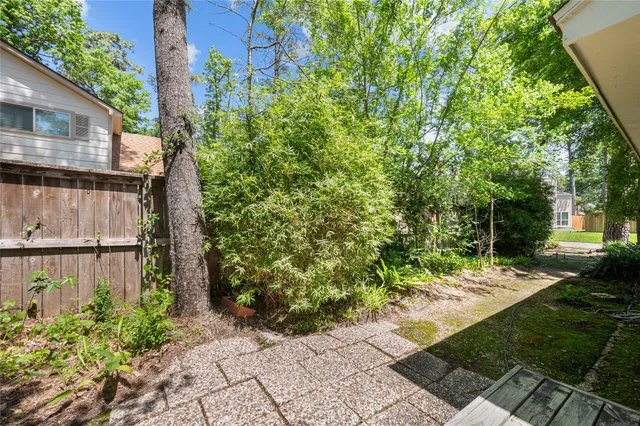 a view of a backyard with sitting area