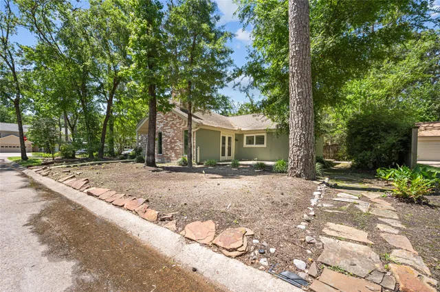 a front view of a house with a yard and a garage