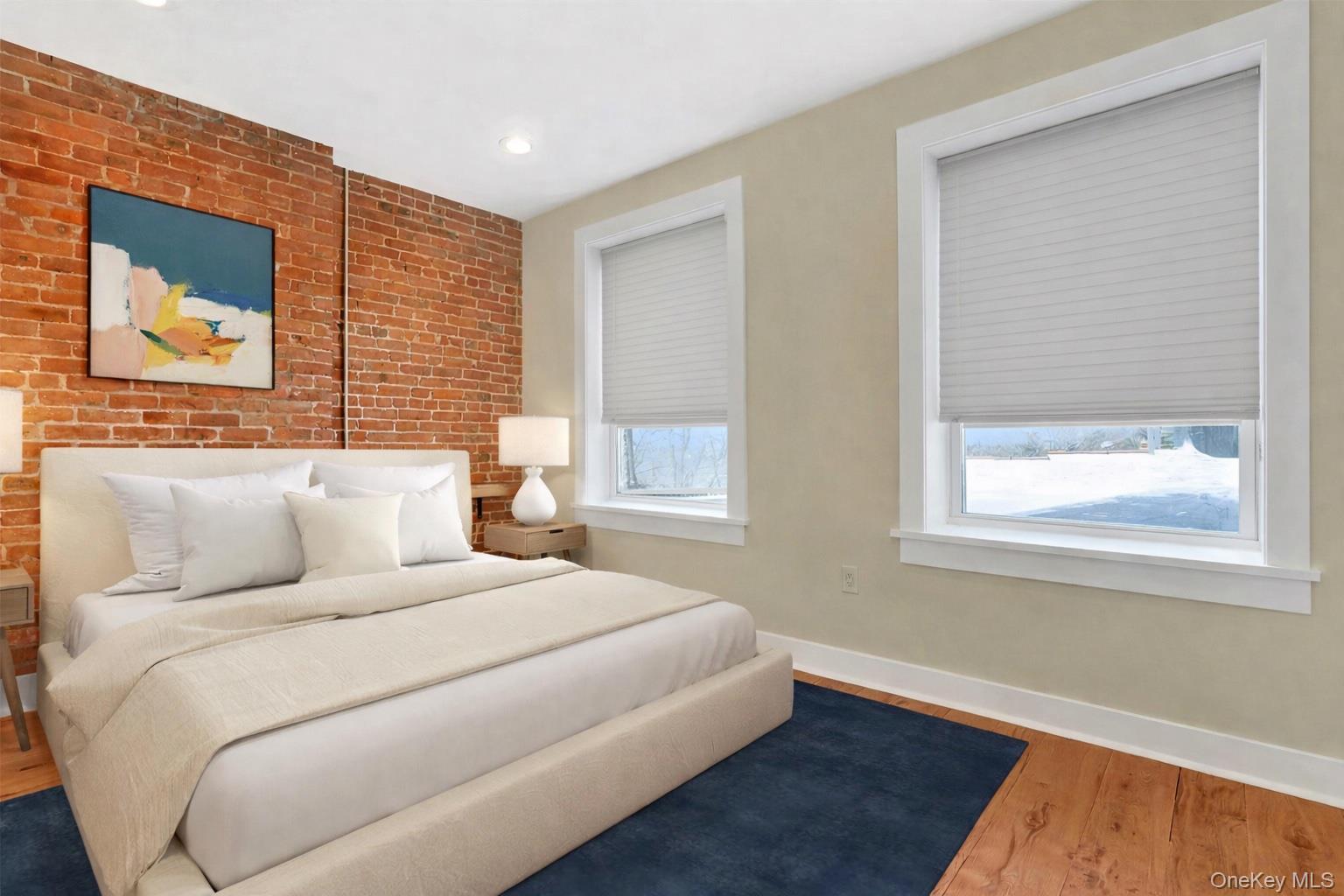 19 Main Street, Unit 2 Tarrytown, NY 10591 - Photo 12 of 24 a bedroom with a bed and a wooden floor