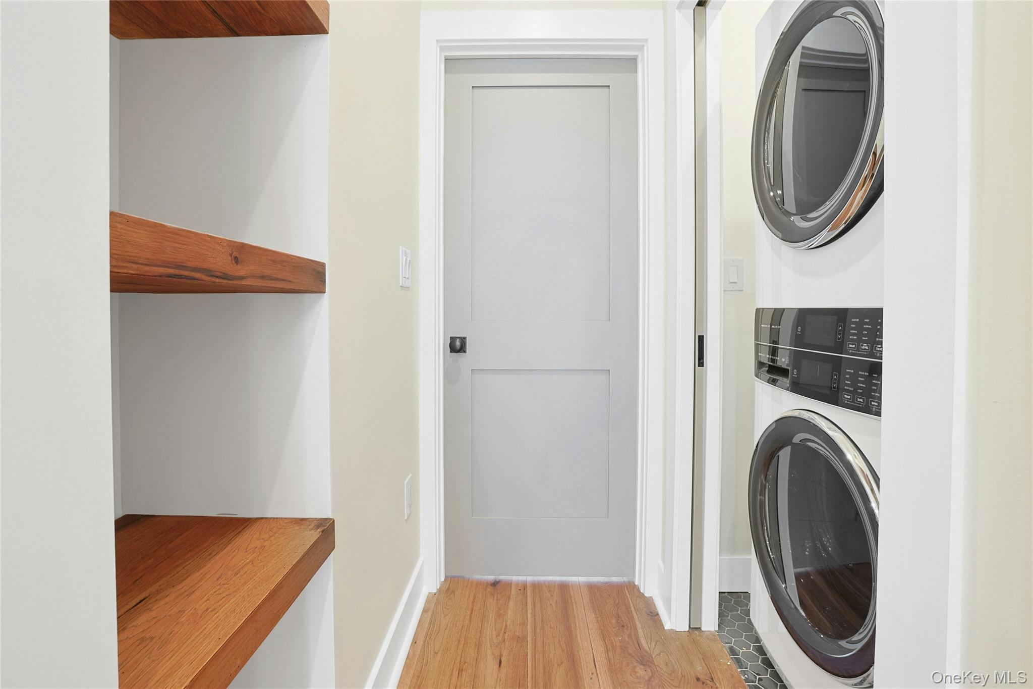 19 Main Street, Unit 2 Tarrytown, NY 10591 - Photo 20 of 24 a view of a hallway with washer and dryer