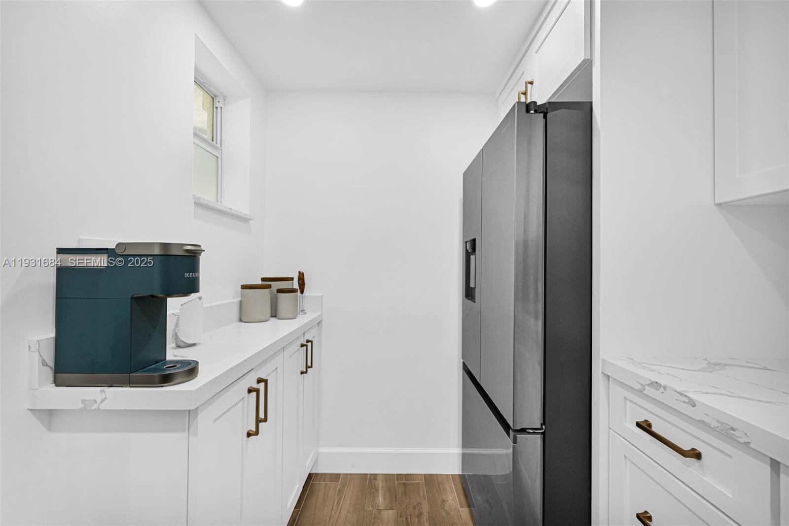 8609 Southwest 68th Court, Unit 24 Pinecrest, FL 33156 - Photo 15 of 40 a kitchen with a sink and cabinets