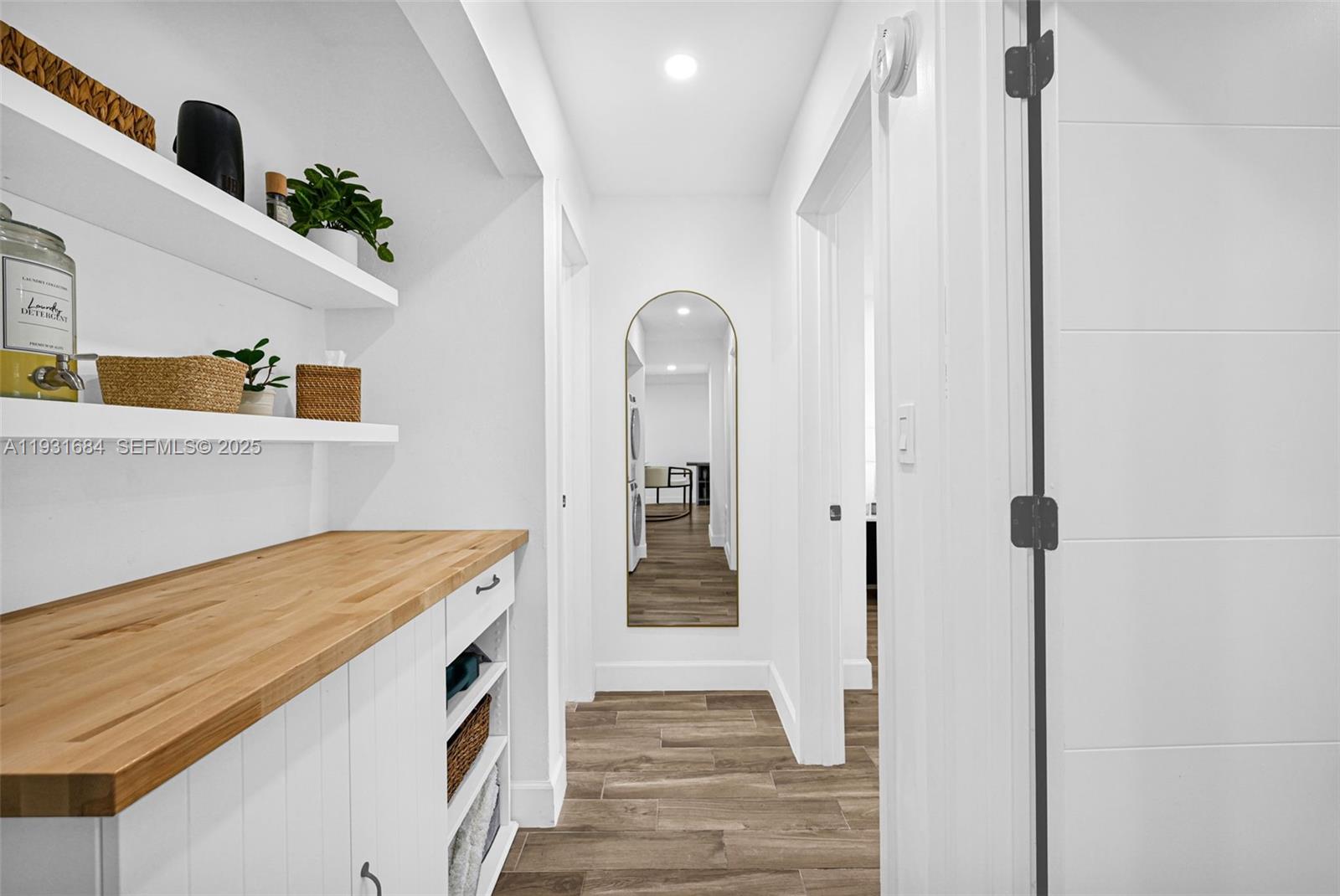 8609 Southwest 68th Court, Unit 24 Pinecrest, FL 33156 - Photo 19 of 40 a bathroom with a sink and a mirror
