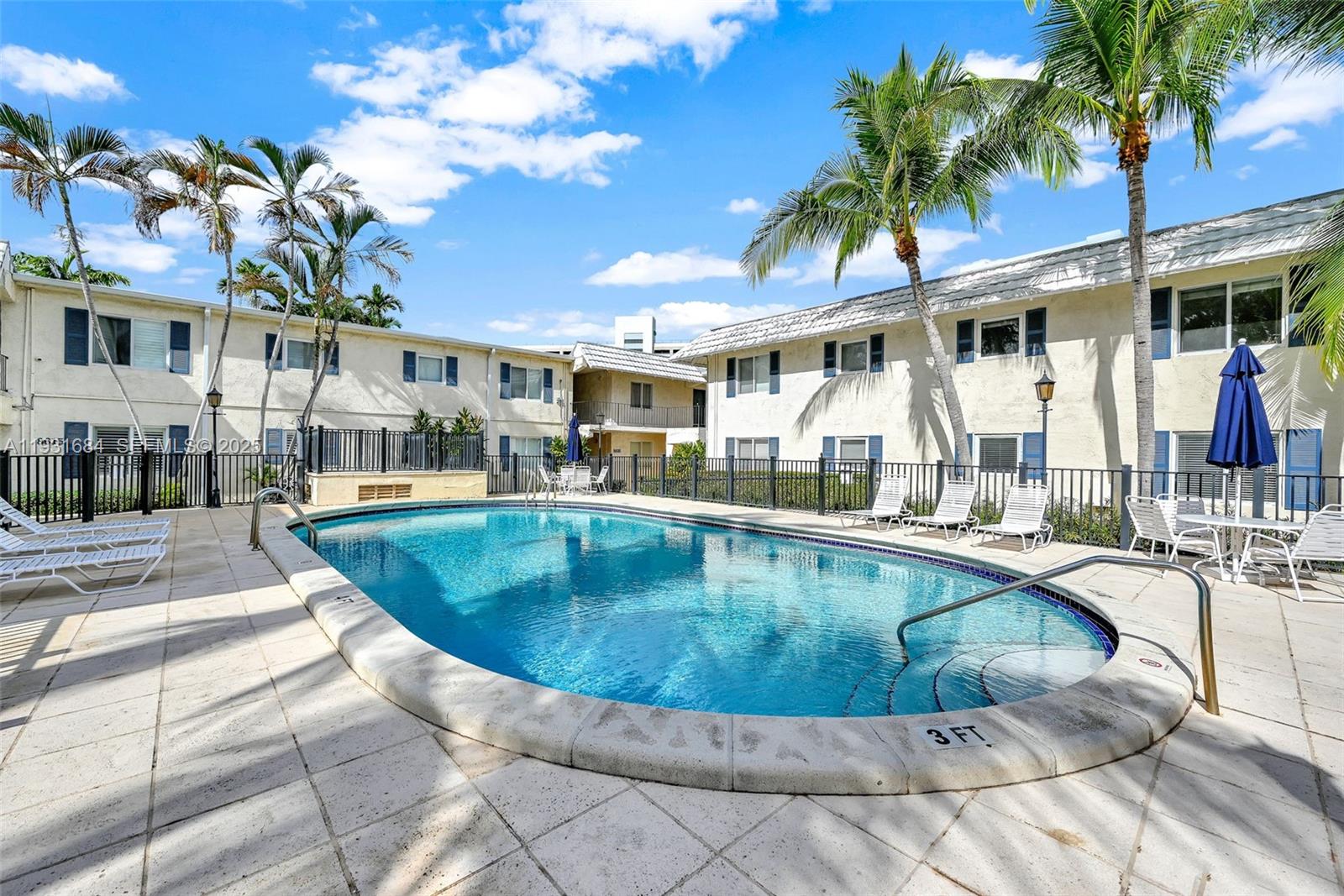 8609 Southwest 68th Court, Unit 24 Pinecrest, FL 33156 - Photo 37 of 40 a view of a house with swimming pool