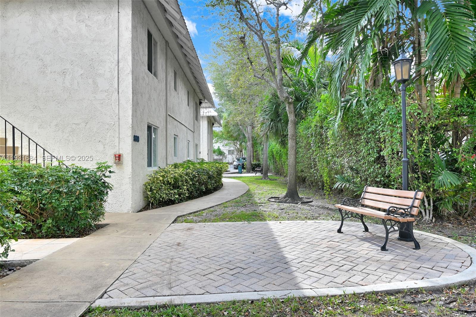 8609 Southwest 68th Court, Unit 24 Pinecrest, FL 33156 - Photo 38 of 40 a view of a backyard with sitting area