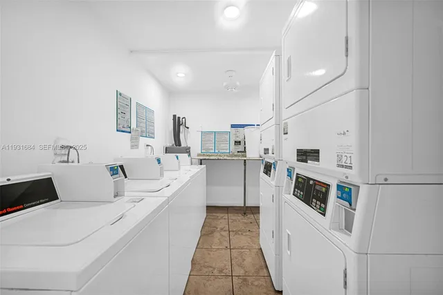 a view of storage and utility room with washer and dryer