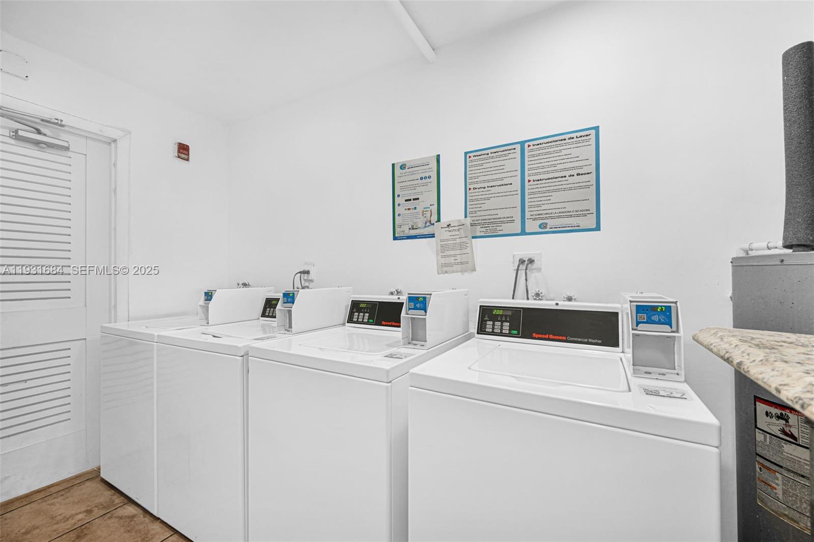 8609 Southwest 68th Court, Unit 24 Pinecrest, FL 33156 - Photo 9 of 40 a view of storage and utility room with washer and dryer