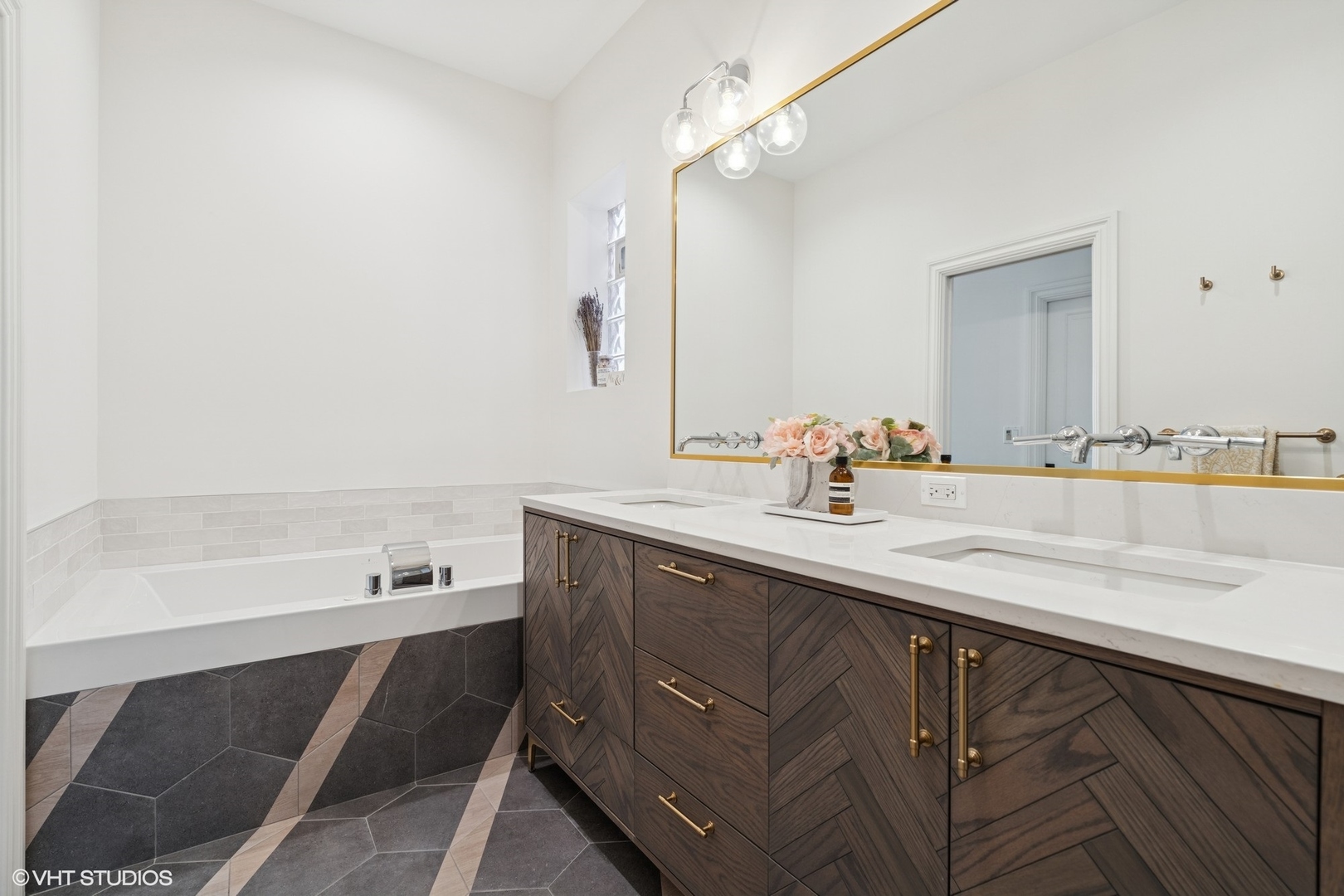952 North Racine Avenue Chicago, IL 60642 - Photo 11 of 24 a bathroom with a sink and a mirror