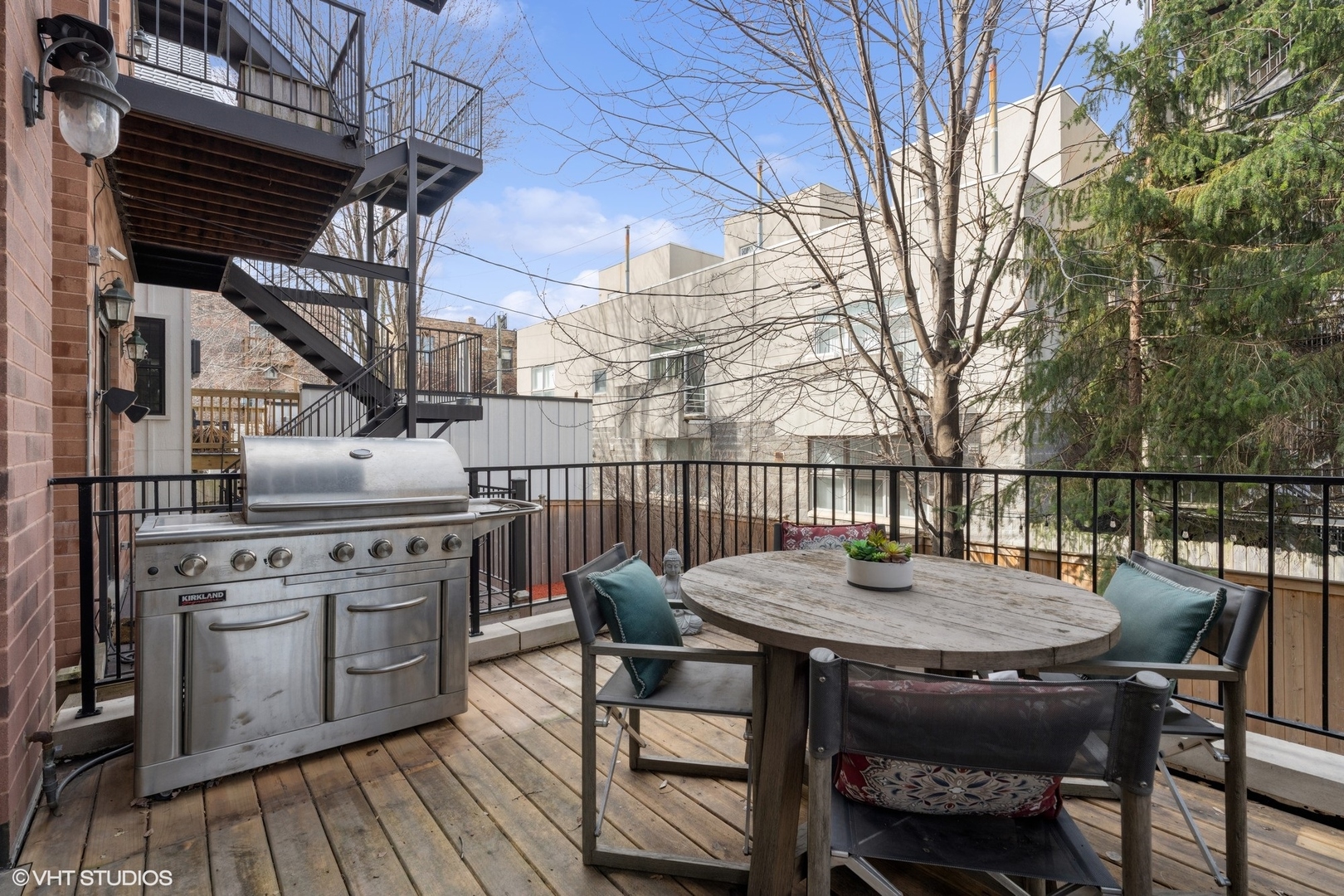 952 North Racine Avenue Chicago, IL 60642 - Photo 21 of 24 a balcony with wooden floor table and chairs