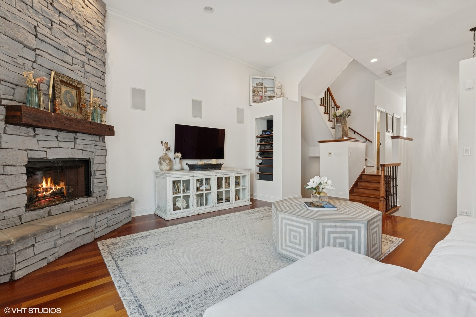 952 North Racine Avenue Chicago, IL 60642 - Photo 3 of 24 a living room with furniture a flat screen tv and a fireplace