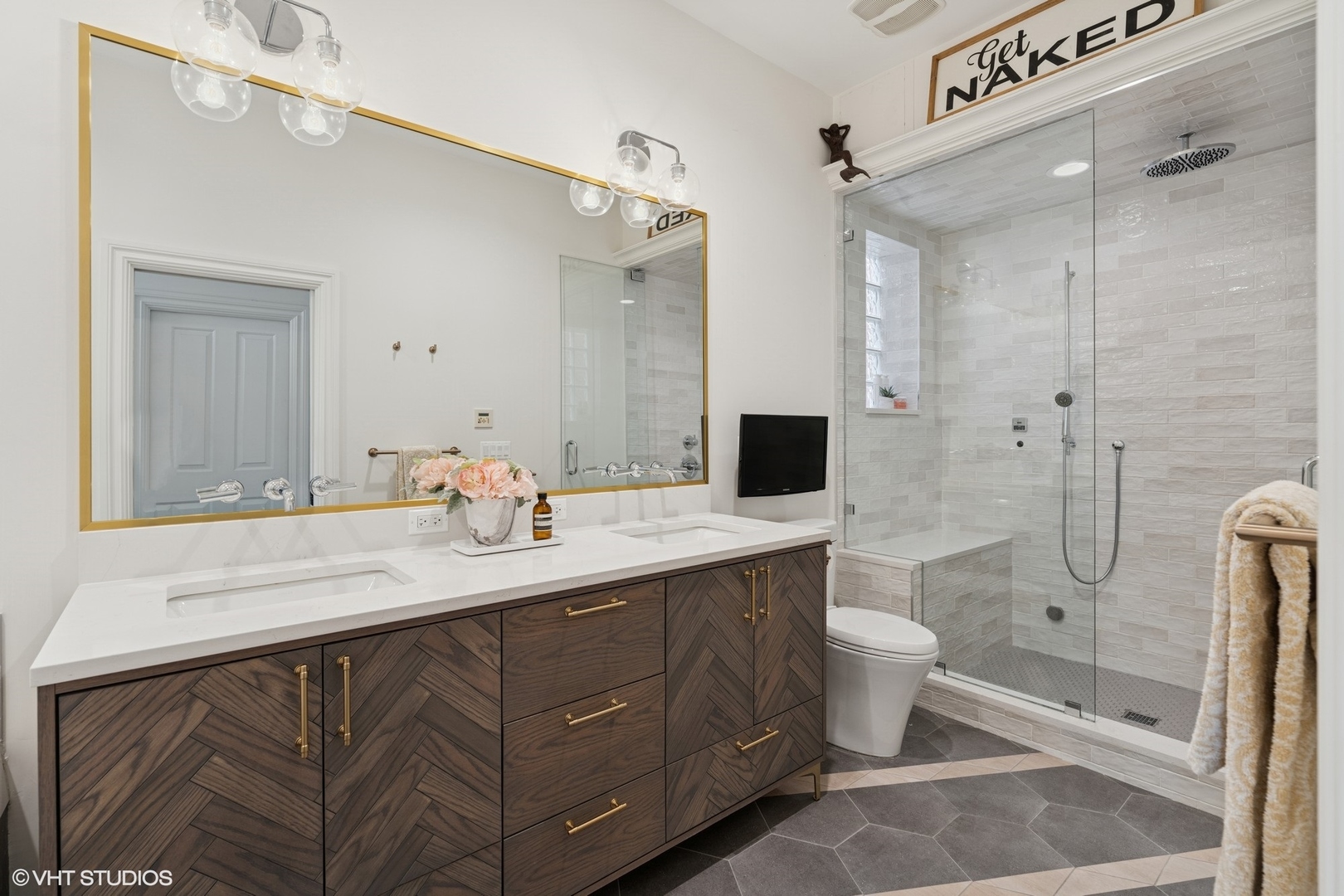952 North Racine Avenue Chicago, IL 60642 - Photo 10 of 24 a bathroom with a double vanity sink mirror double shower and toilet