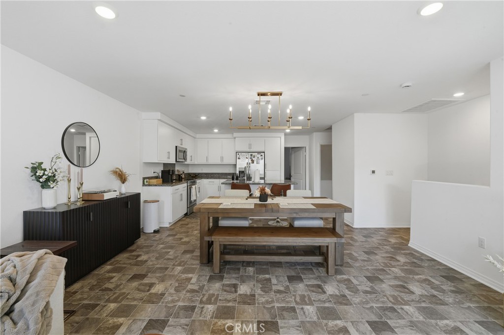 19210 Ash Grv Street Riverside, CA 92507 - Photo 11 of 38 a living room with kitchen furniture and kitchen view