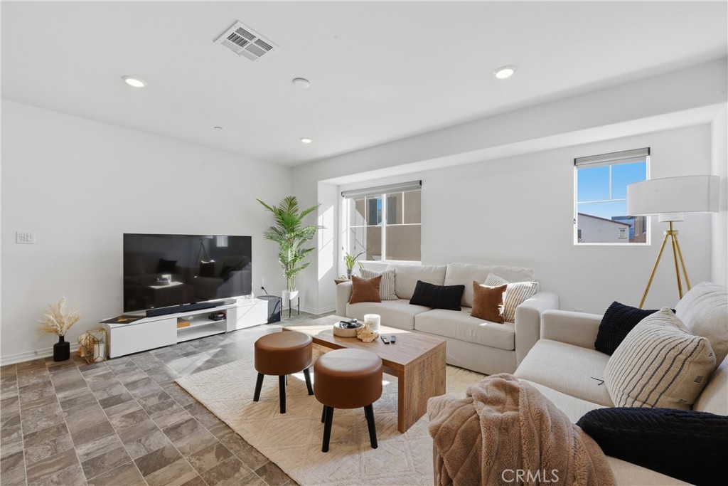 19210 Ash Grv Street Riverside, CA 92507 - Photo 13 of 38 a living room with furniture and a flat screen tv