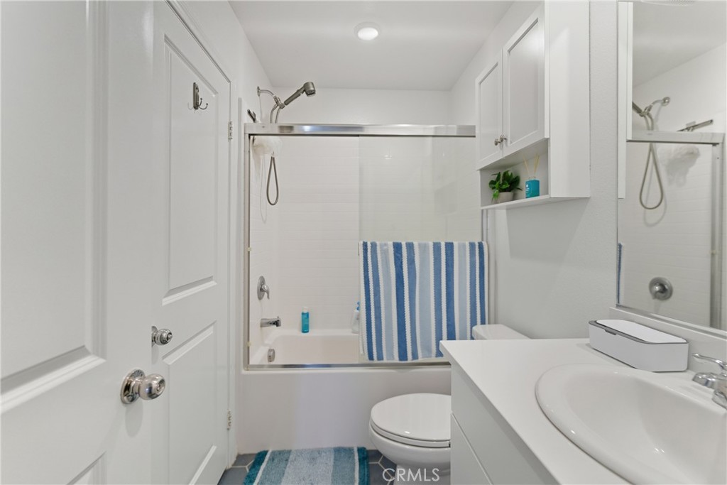 19210 Ash Grv Street Riverside, CA 92507 - Photo 23 of 38 a bathroom with a sink toilet and shower