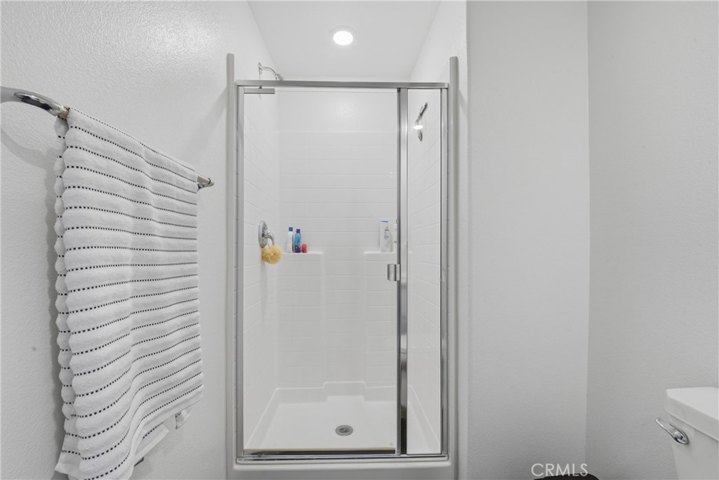 19210 Ash Grv Street Riverside, CA 92507 - Photo 29 of 38 a bathroom with a shower and a toilet