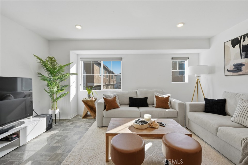 19210 Ash Grv Street Riverside, CA 92507 - Photo 9 of 38 a living room with furniture potted plant and a window