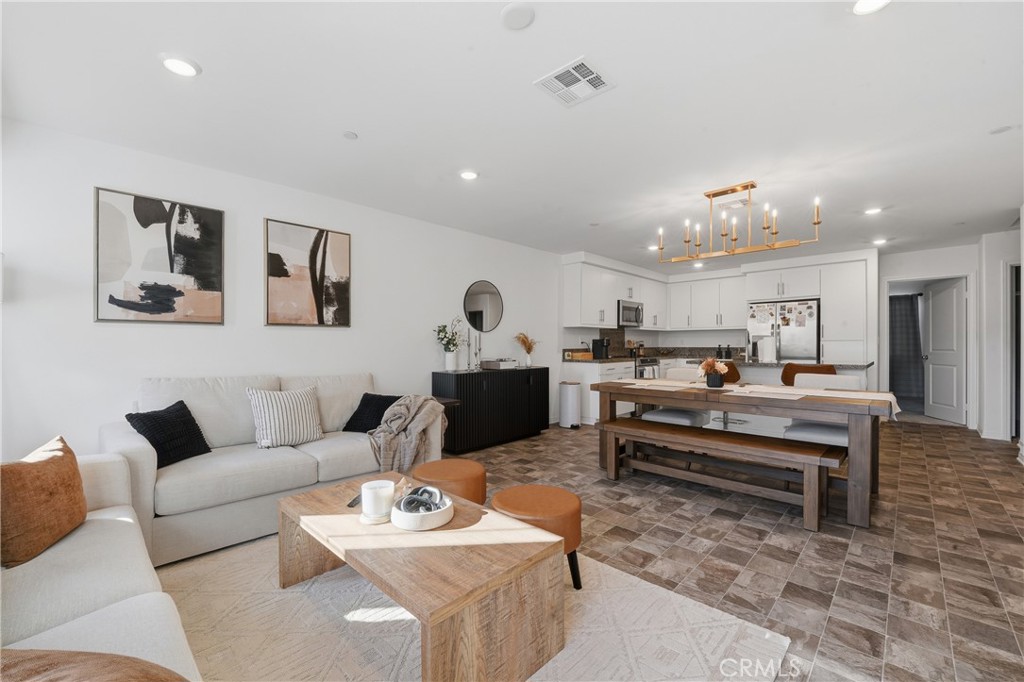 19210 Ash Grv Street Riverside, CA 92507 - Photo 10 of 38 a living room with furniture and kitchen view