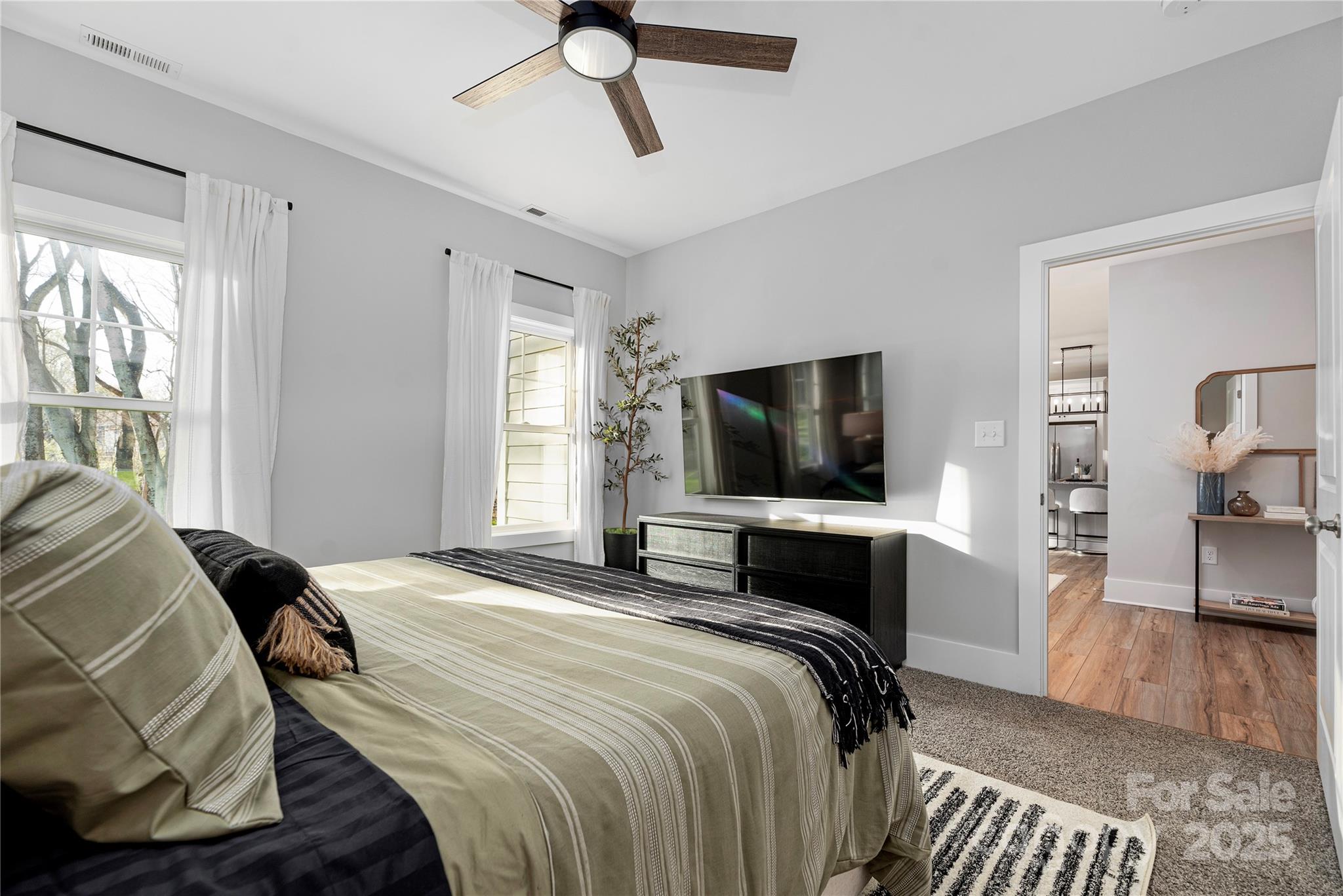 9849 Rich Hatchet Road Huntersville, NC 28078 - Photo 16 of 41 a bedroom with a bed and a television