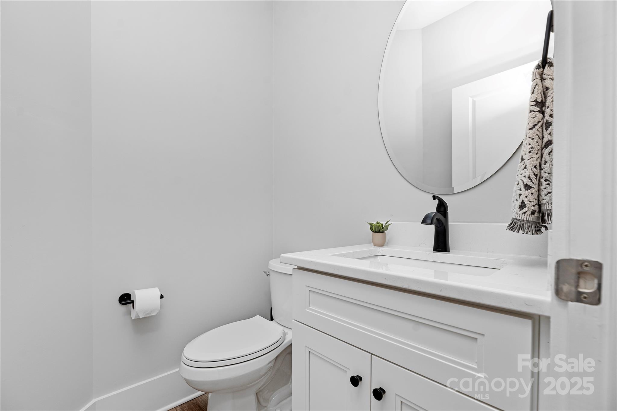 9849 Rich Hatchet Road Huntersville, NC 28078 - Photo 22 of 41 a bathroom with a sink toilet and a mirror