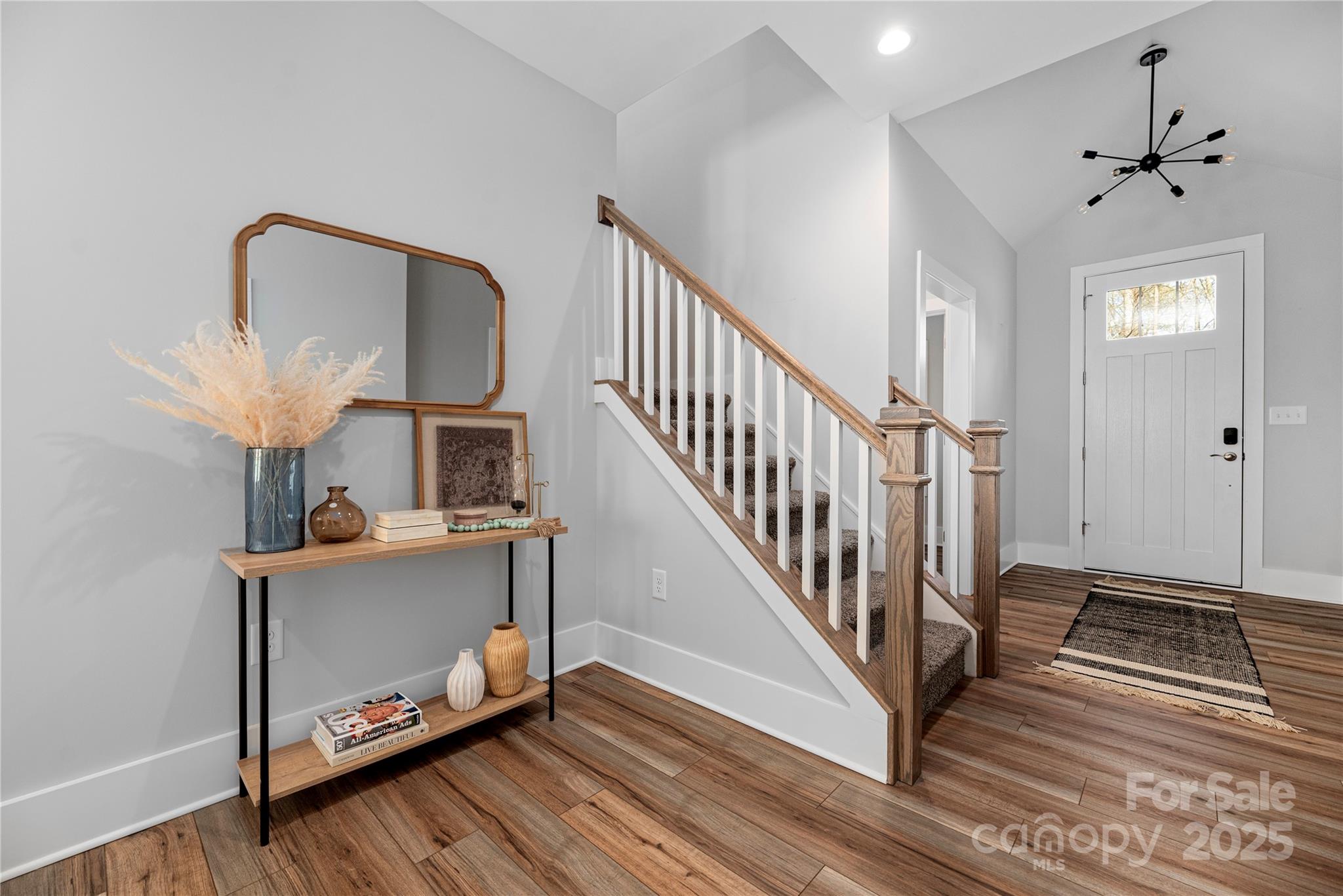9849 Rich Hatchet Road Huntersville, NC 28078 - Photo 8 of 41 a view of a hallway with wooden floor and staircase