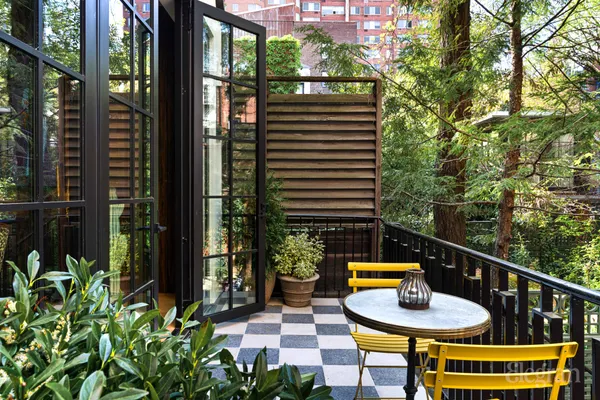 a table chair in a kitchen next to a window