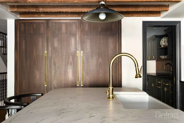 a kitchen with a sink and a microwave