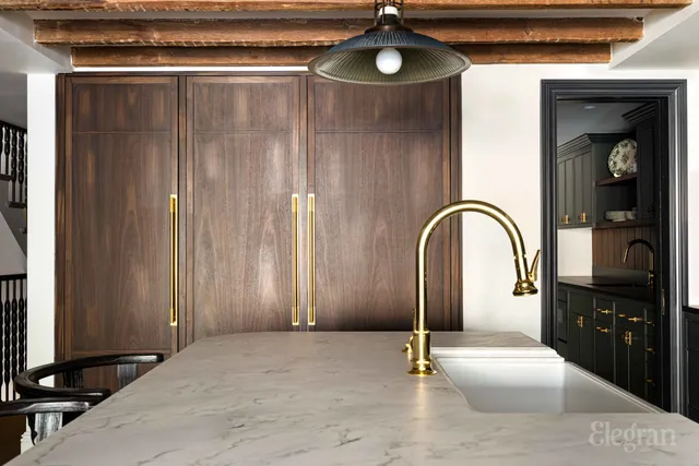 a kitchen with a sink and a microwave