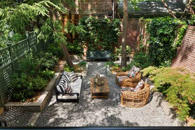 a backyard of a house with outdoor seating