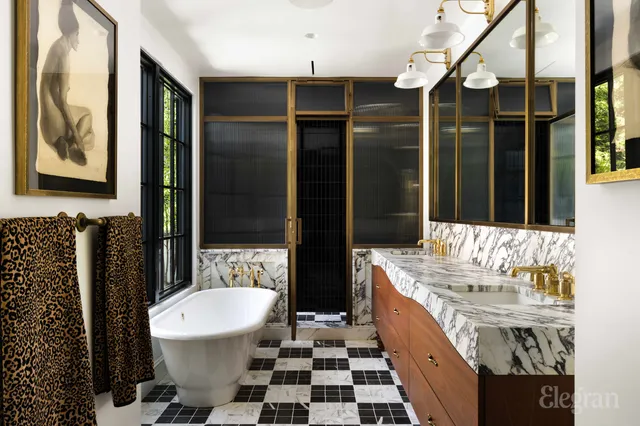 a bathroom with a sink a toilet a mirror and shower