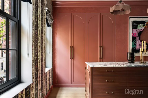 a bedroom with a bed and a chair