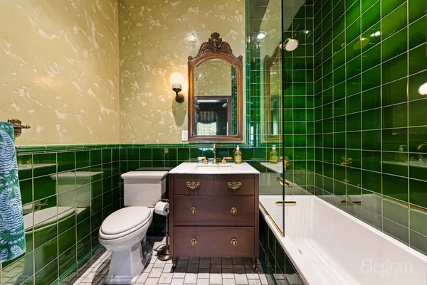 a dining room with furniture and a window