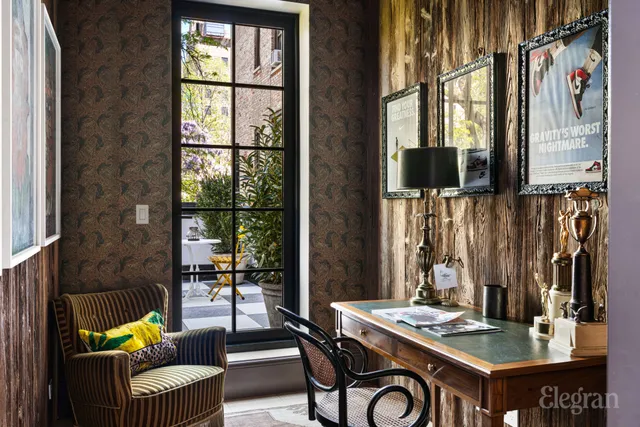 a living room with a bed and furniture