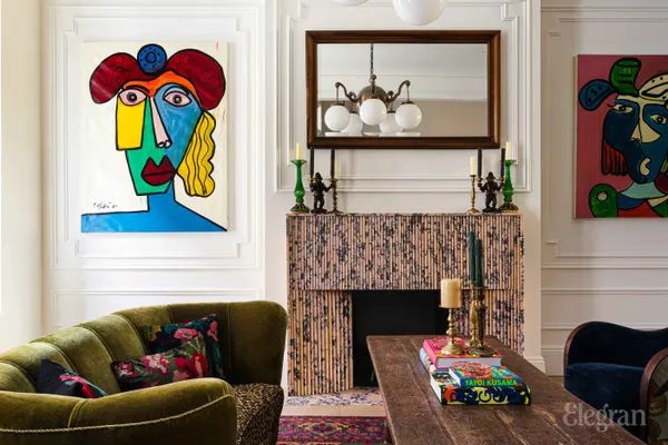 a living room with fireplace furniture and a book shelf