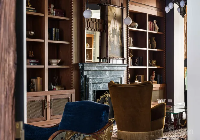 a living room with furniture a chandelier and a window