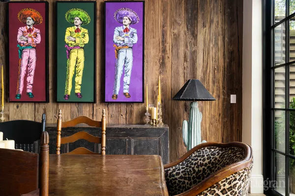 a dining room with furniture window and wooden floor