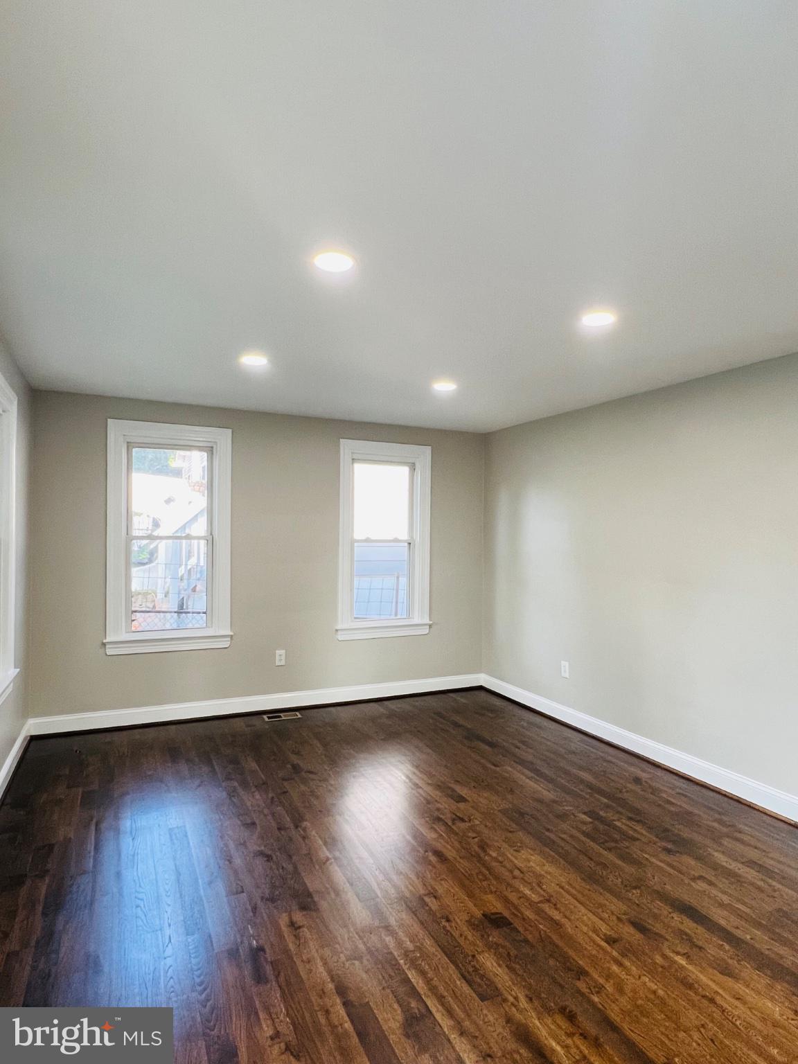 5709 Dade Street Capitol Heights, MD 20743 - Photo 15 of 30 an empty room with wooden floor and windows