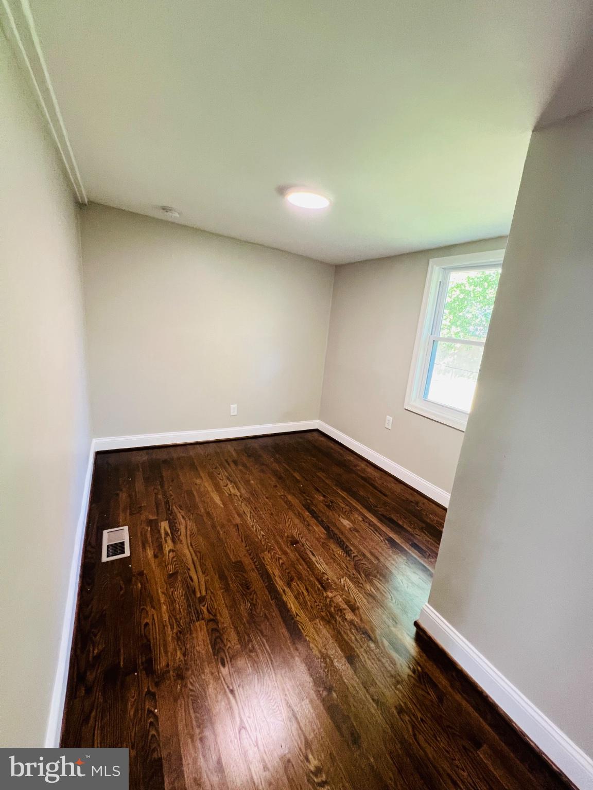 5709 Dade Street Capitol Heights, MD 20743 - Photo 17 of 30 an empty room with wooden floor