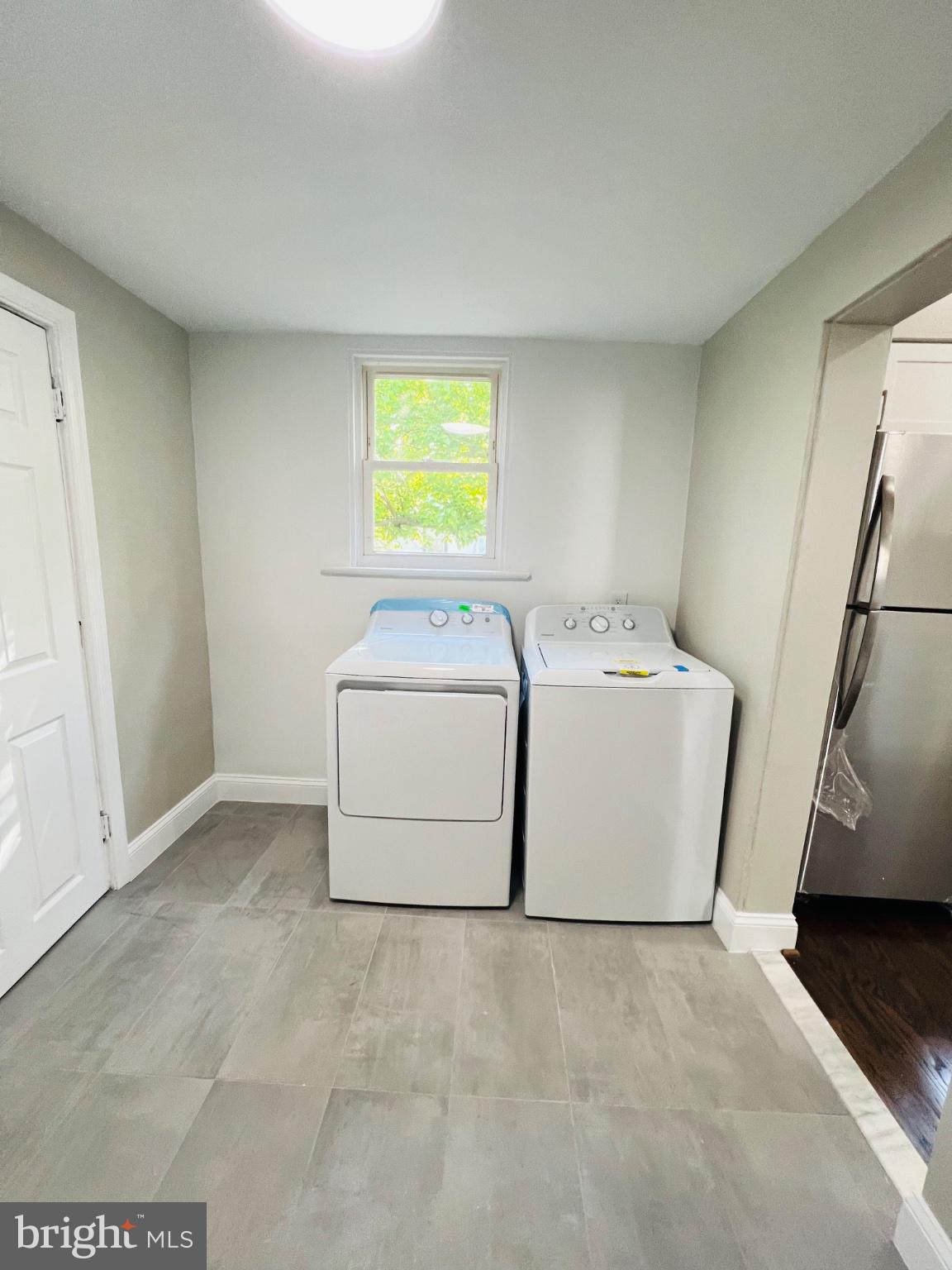 5709 Dade Street Capitol Heights, MD 20743 - Photo 18 of 30 a utility room with dryer and washer